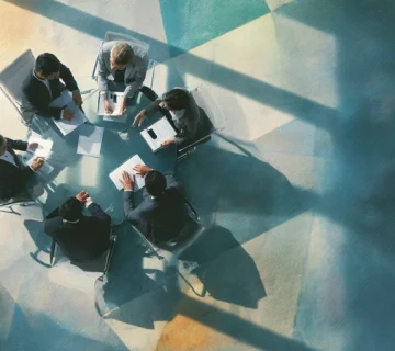Iranian managers in a modern office demonstrating how small daily behaviors shape invisible organizational culture